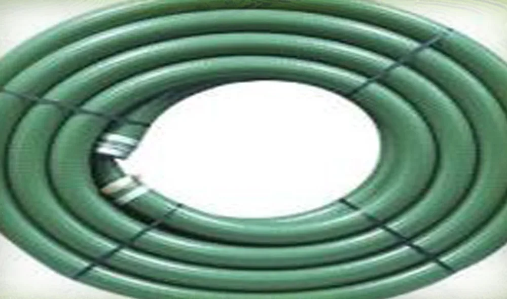 Green Kamalflex suction hose coiled