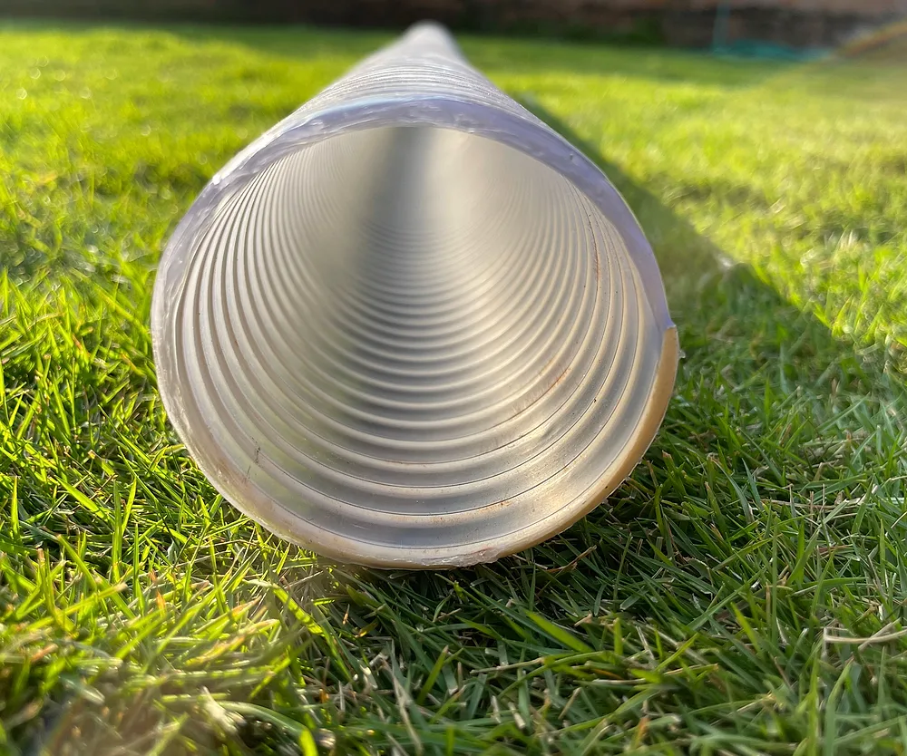 End view of a white spiral suction hose